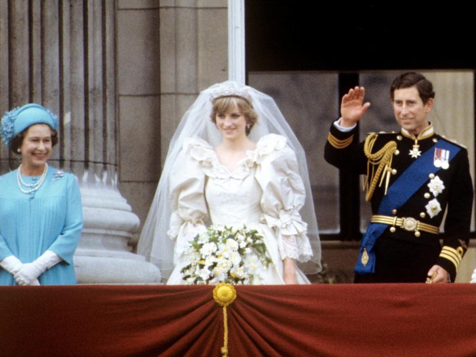 The Queen with Princess Diana and Prince Charles on the balcony of Buckingham Palace on their wedding day in 1981 (PA)