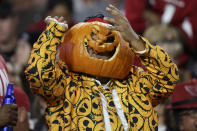 A fan dressed in a halloween costume cheers during the second half of an NFL football game between the San Francisco 49ers and the Arizona Cardinals, Thursday, Oct. 31, 2019, in Glendale, Ariz. (AP Photo/Ross D. Franklin)