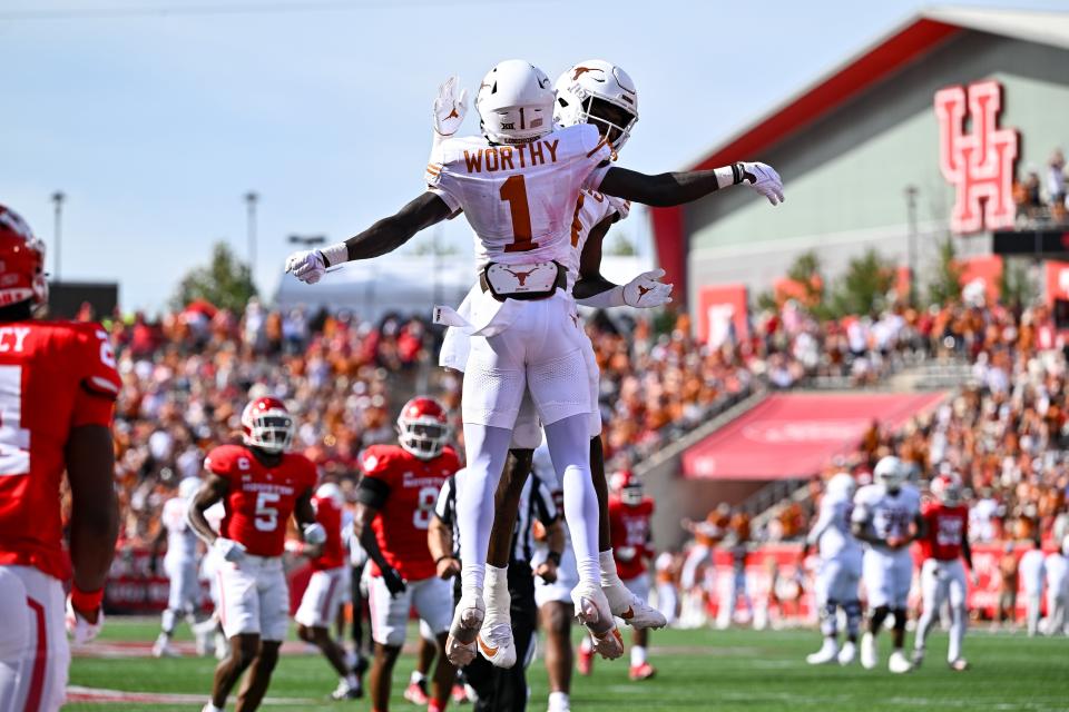 Texas wide receiver Xavier Worthy celebrates his touchdown catch during the first quarter in the Oct. 21 win over Houston. The Longhorns are No. 7 in the first CFP rankings heading into Saturday's showdown with No. 23 Kansas State.