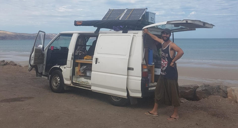 Adam Papadopoulos with the van he and his partner were travelling in as they drove across Australia. Source: Adam Papadopoulos