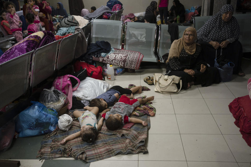 Palestinians take shelter in the Nasser hospital during ongoing Israeli bombardment in Khan Younis, Gaza Strip, Friday, Oct. 27, 2023. (AP Photo/Fatima Shbair)