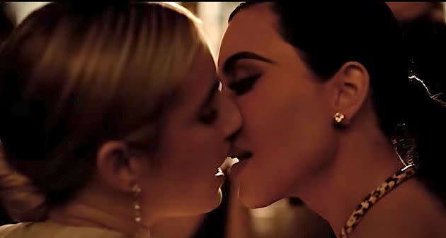 Emma Roberts, left, and Kim Kardashian kiss in 