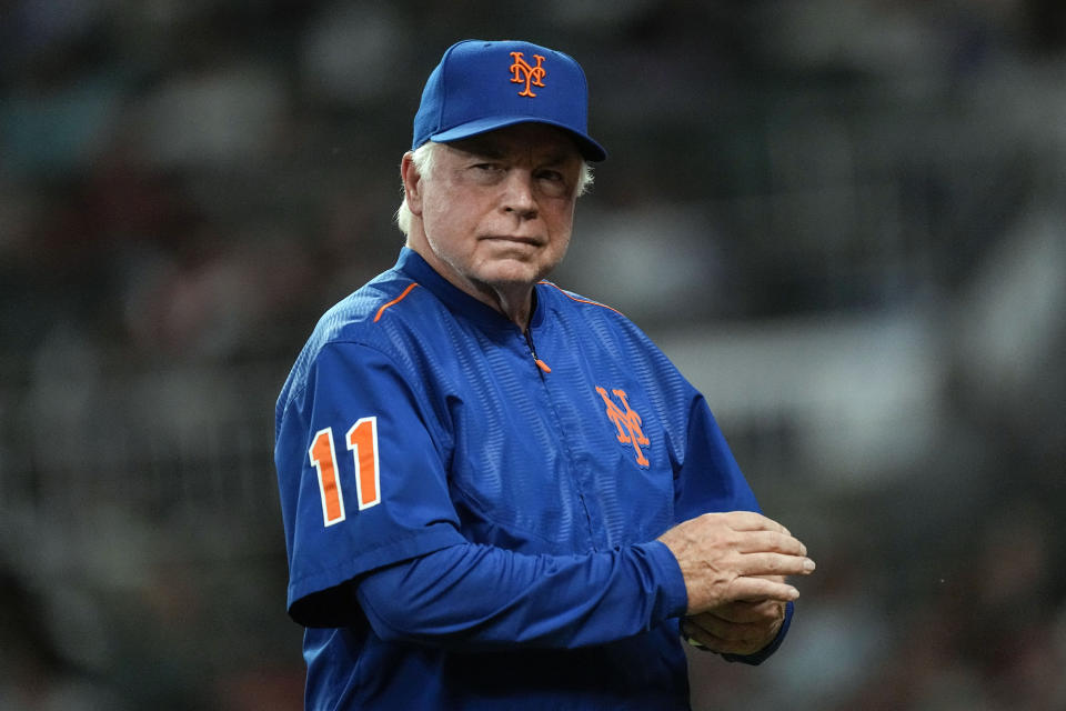 New York Mets manager Buck Showalter walks back to the dugout after making a pitching change in the eighth inning of a baseball game against the Atlanta Braves, Wednesday, June 7, 2023, in Atlanta. (AP Photo/John Bazemore)
