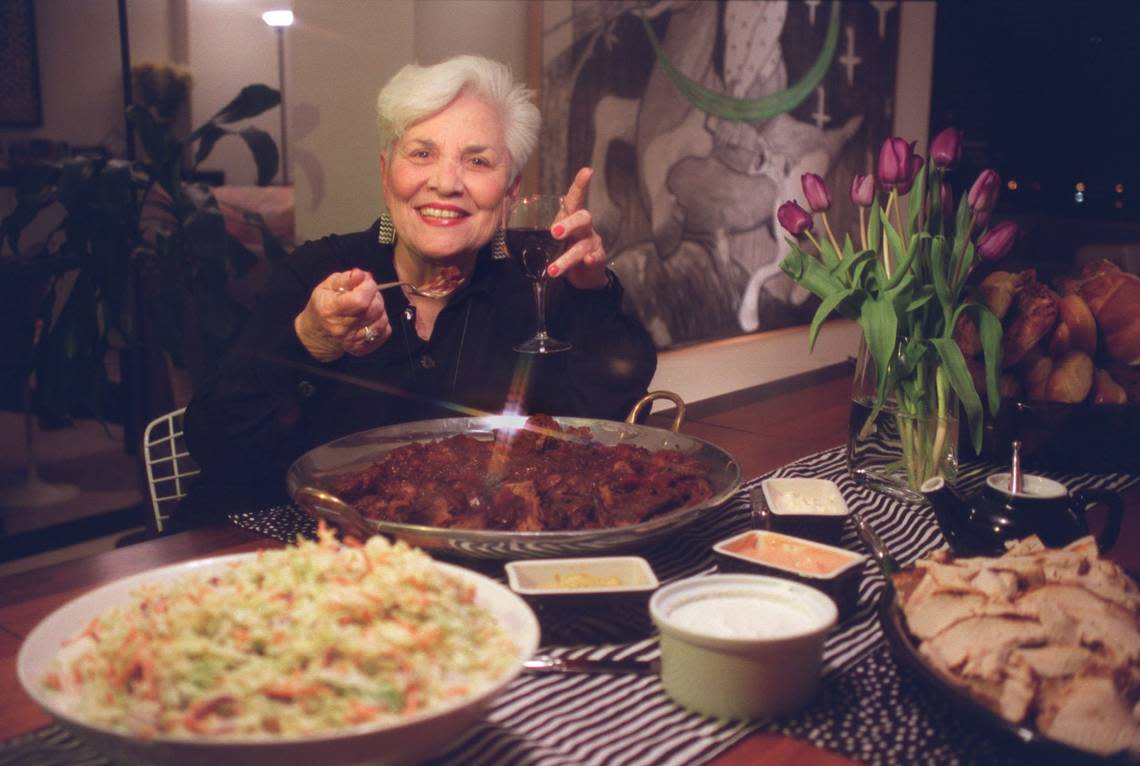Gallery owner Barbara Gillman throws a party to celebrate the opening of her new gallery in Edgewater on Biscayne Blvd. Saturday night. Here, she serves the beef Brisket that she is known for.