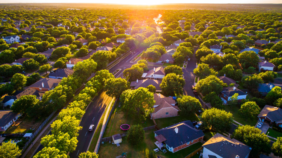 Brushy Creek Suburb Homes above Neighborhood in Austin , Texas suburb of Round Rock , TX aerial drone view high above Texas Hill Country houses golden hour sunset sun rays and lens flare - Image.