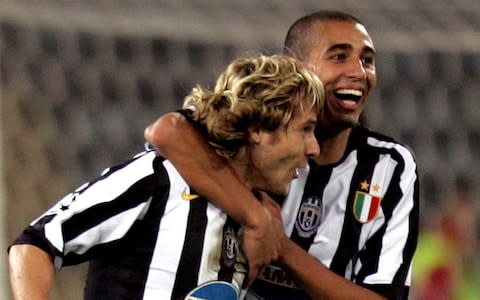 Juventus' David Trezeguet of France, right, celebrates with his teammate Pavel Nedved of the Czech Republic after scoring against Bayern Munich during their Champions League - Credit: AP