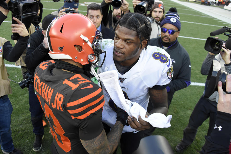 By signing wide receiver Odell Beckham (left), did the Baltimore Ravens boost their chances of ending their contract standoff with Lamar Jackson? (Photo by Jason Miller/Getty Images)