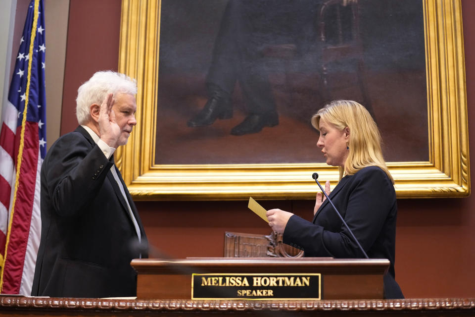 Chief Clerk Patrick Duffy Murphy is sworn in by Speaker of the House Melissa Hortman after being re-elected during the first day of the 2023 legislative session, Tuesday, Jan. 3, 2023, in St. Paul, Minn. (AP Photo/Abbie Parr)