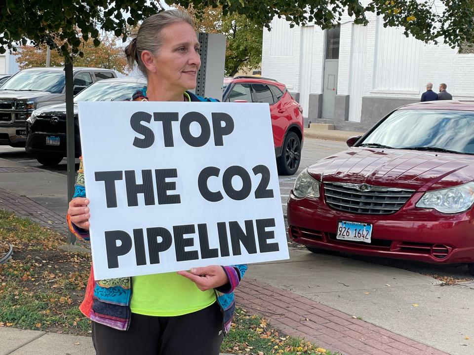 Crystal Faux of Green Valley protests a proposed CO2 pipeline outside of the Tazewell County Justice Center