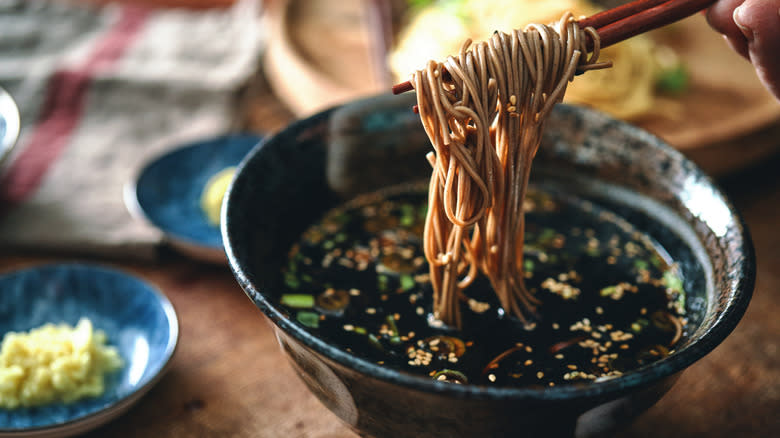 noodles dipped in soy sauce