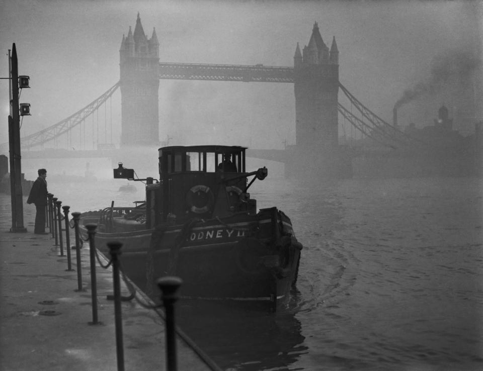 A tugboat on the Thames near Tower Bridge in heavy smog, 1952 (Fox Photos/Hulton Archive/Getty Images)