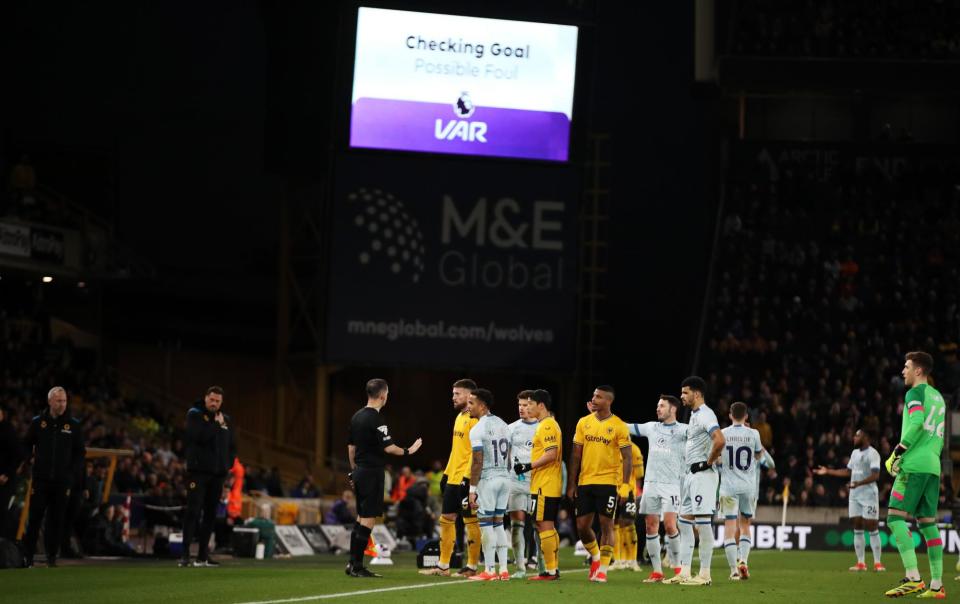 <span>Wolves players protest during the VAR intervention which led to Hwang Hee-chan’s goal against Bournemouth in April being disallowed.</span><span>Photograph: Jack Thomas/WWFC/Getty Images</span>