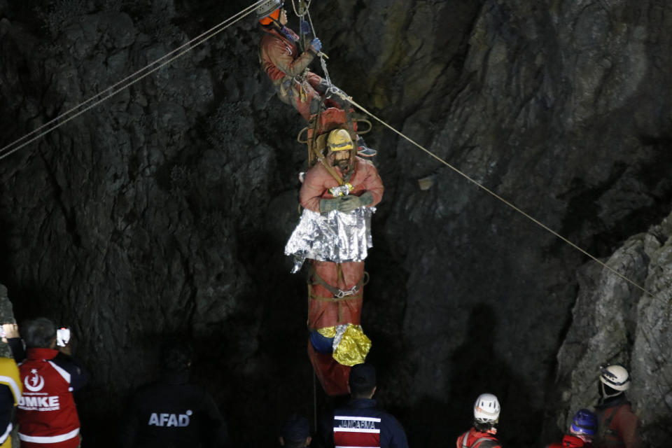 Rescuers pull American researcher Mark Dickey out of Morca cave near Anamur, south Turkey, on early Tuesday, Sept. 12, 2023. Teams from across Europe had rushed to Morca cave in southern Turkey's Taurus Mountains to aid Dickey, a 40-year-old experienced caver who became seriously ill on Sept. 2 with stomach bleeding. (Suleyman Cenk Idaye/IHA via AP)