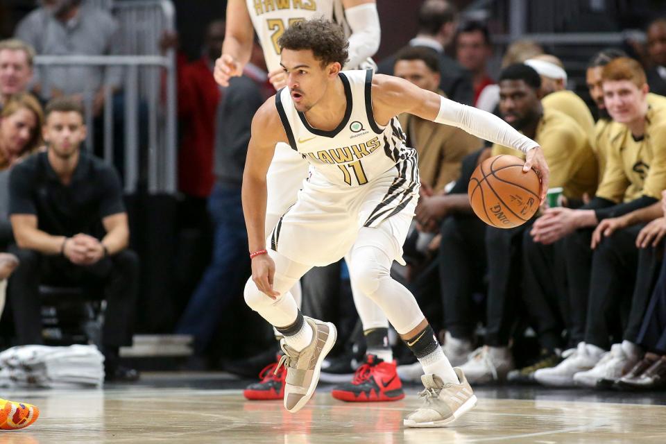 Atlanta Hawks guard Trae Young dribbles against the Detroit Pistons in the first quarter at State Farm Arena, Nov. 9, 2018 in Atlanta.