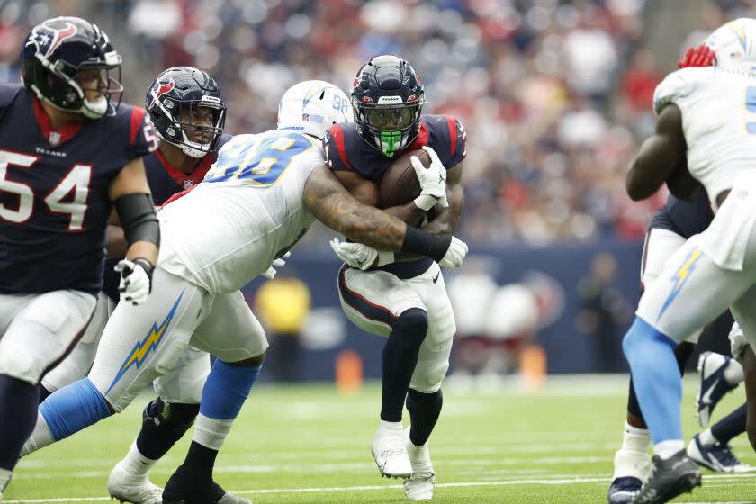 Houston Texans running back Dameon Pierce (32) carries the ball during an NFL football game against the Los Angeles Chargers on Sunday, October 2, 2022, in Houston. (AP Photo/Matt Patterson)