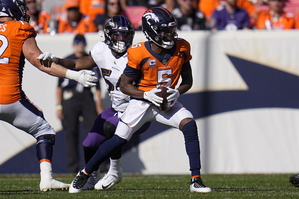 Denver Broncos quarterback Teddy Bridgewater (5) is hurried by Baltimore Ravens outside linebacker Tyus Bowser (54) during the first half of an NFL football game, Sunday, Oct. 3, 2021, in Denver. (AP Photo/Jack Dempsey)