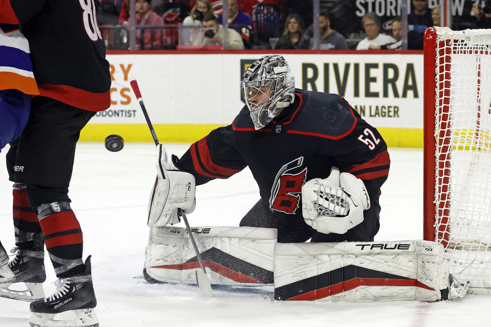 Carolina Hurricanes goaltender Pyotr Kochetkov watches the puck against the New York Islanders during the first period of an NHL hockey game in Raleigh, N.C., Thursday, Nov. 30, 2023. (AP Photo/Karl B DeBlaker)