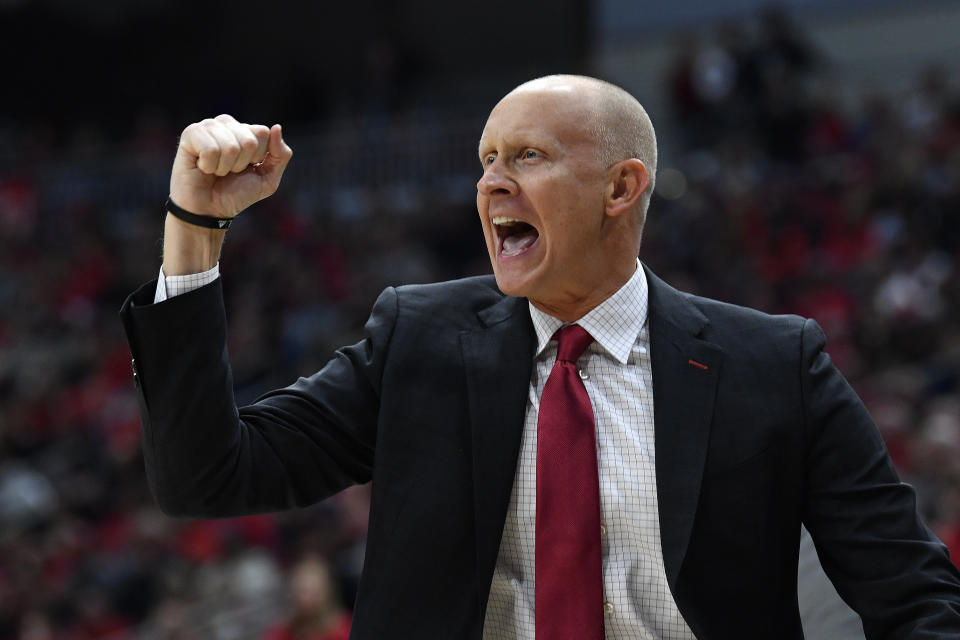 Louisville head coach Chris Mack reacts to a play during the first half of an NCAA college basketball game in Louisville, Ky., Friday, Dec. 6, 2019. (AP Photo/Timothy D. Easley)