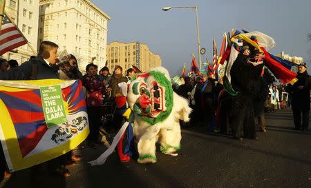 Supporters of the Dalai Lama rally outside the site of the National Prayer Breakfast which he is attending at the Washington Hilton in Washington, February 5, 2015. REUTERS/Jonathan Ernst