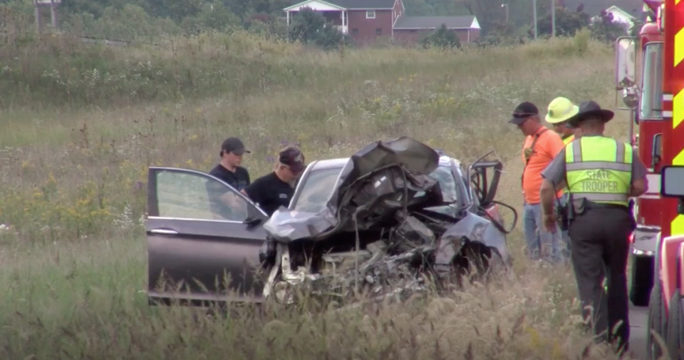 Police say a man thrown from the car during the crash died hours earlier.