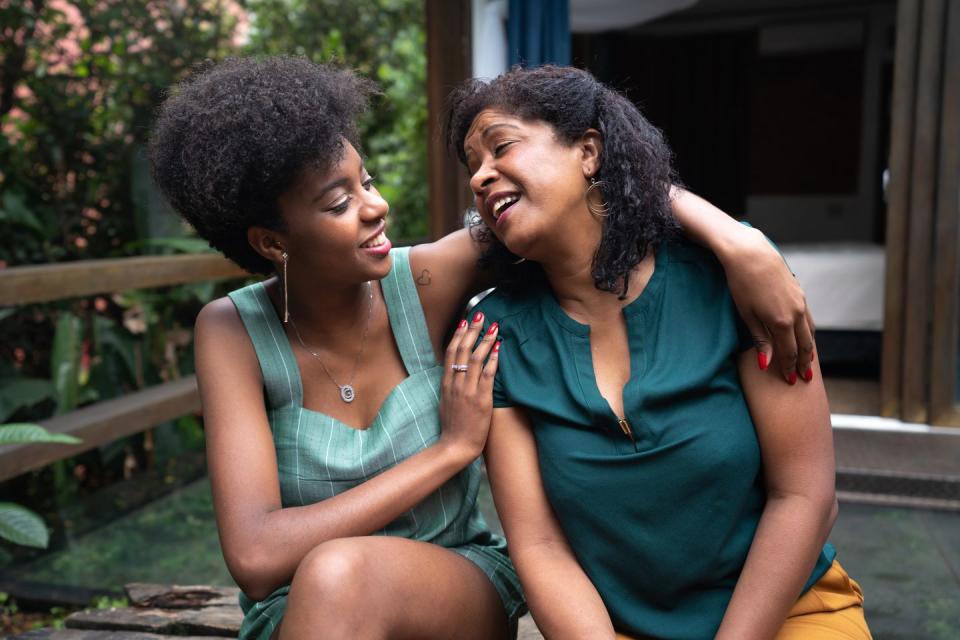 mother and daughter embracing at home