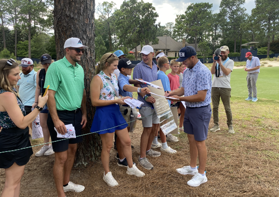 Colin Prater signs autographs for fans at the U.S. Open. (Jay Busbee/Yahoo Sports)