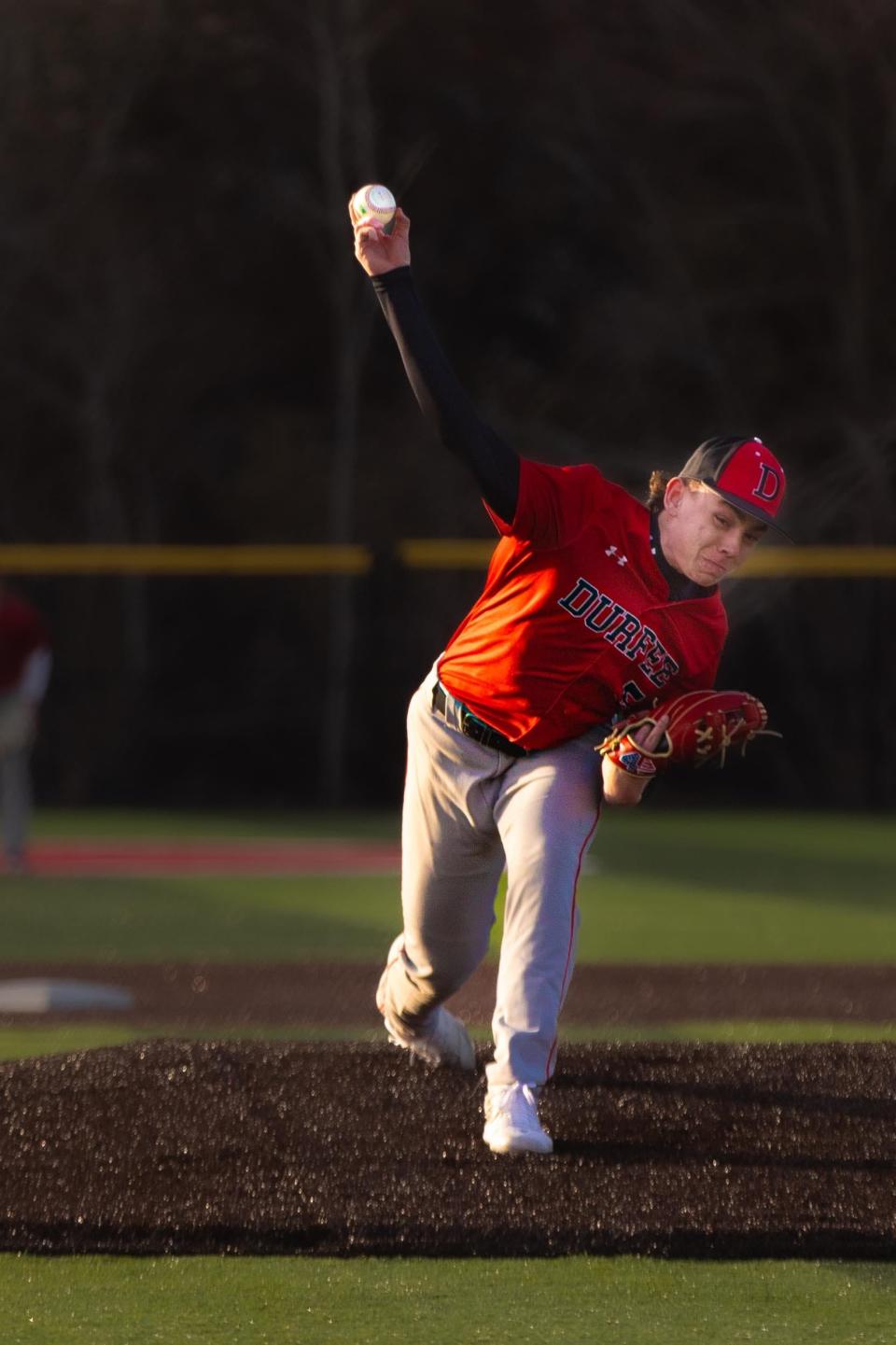Durfee's Matthew Almedia fires a pitch across the plate during Tuesday's night game against Somerset Berkley at B.M.C. Durfee High School April 9, 2024.