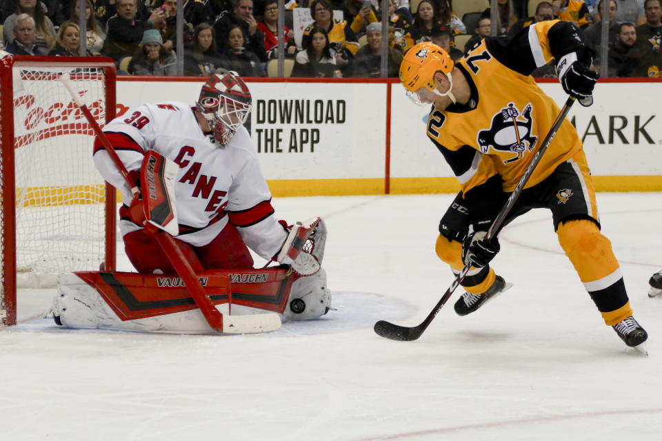 Carolina Hurricanes goaltender Alex Nedeljkovic (39) makes a see on Pittsburgh Penguins' Patric Hornqvist (72) during the second period of an NHL hockey game, Sunday, March 8, 2020, in Pittsburgh. (AP Photo/Keith Srakocic)