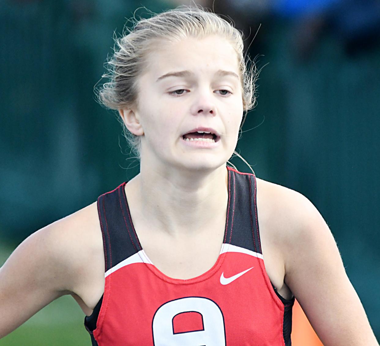 Eighth-grader Madalyn Madsen took ninth in the girls' 5,000-meter race Wednesday during the Region 2B cross country meet at the Sunrise Ridge Golf Course in Colman. Arlington's boys and girls each repeated as team champions and qualified for the state meet on Saturday, Oct. 22 at Huron.