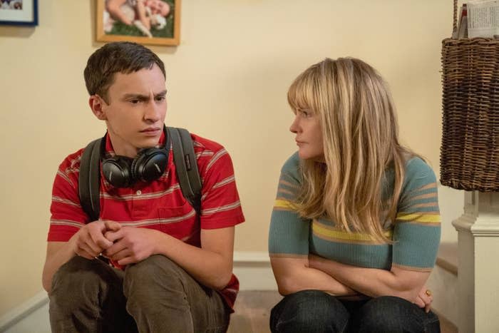 Sam and his mom sitting  on the stairs