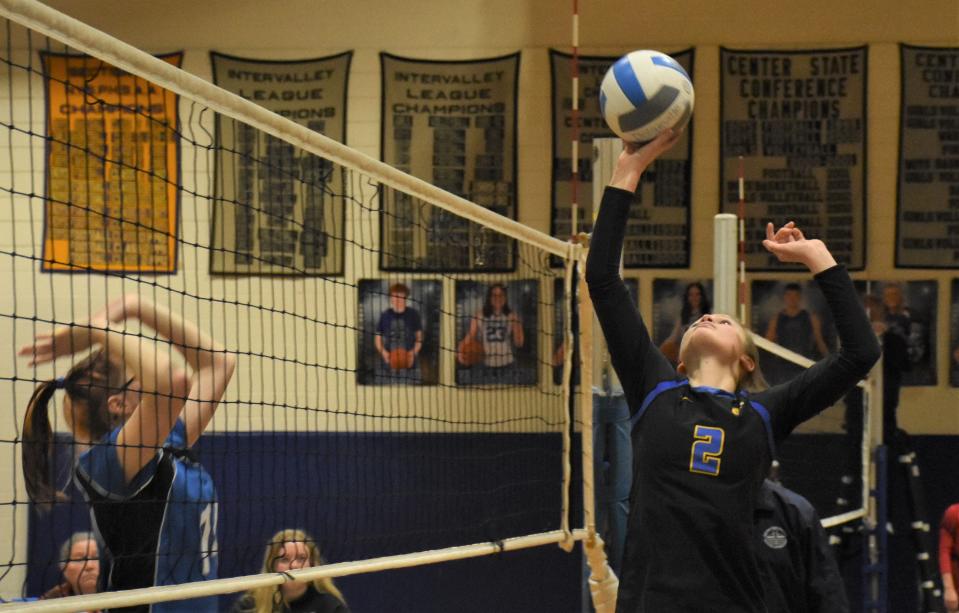 Mt. Markham Mustang Haley Otis (2) tips the ball over the net against Dolgeville at the Blue Devils' annual Finale Tournament Saturday. Otis and the Mustangs are one of two unbeaten teams enterng the Section III tournament and the No. 1 seed for Class C.