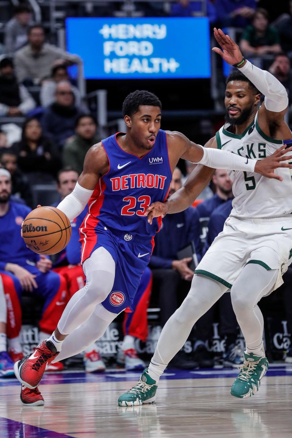 Detroit Pistons guard Jaden Ivey dribbles against Milwaukee Bucks guard Malik Beasley during the second half at Little Caesars Arena in Detroit on Saturday, Jan. 20, 2024.