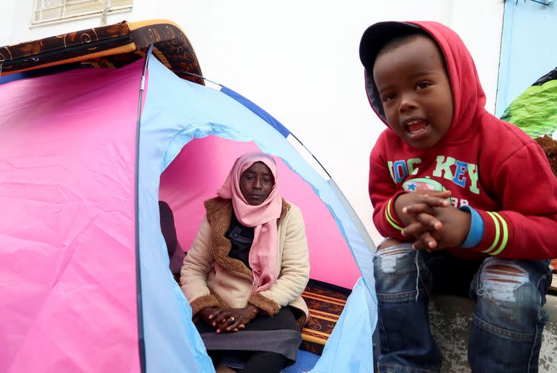 Sudanese refugee, Awadhya Hasan Amine, sits in her tent at a temporary camp, near the UNHCR headquarters in Tunis