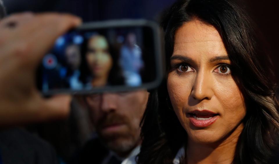 Rep. Tulsi Gabbard, D-Hawaii, answers questions after debate hosted by CNN Thursday, Aug. 1, 2019, in Detroit.