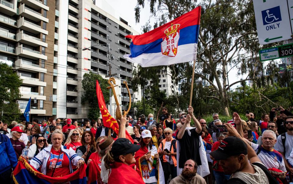 Serbian tennis fans and anti vaccination protesters rally outside the Park Hotel - GETTY IMAGES