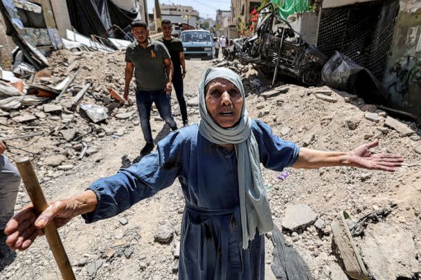 PHOTO: A woman reacts as she stands by the rubble of broken pavement along an alley in Jenin in the occupied West Bank, July 5, 2023, after the Israeli army declared the end of a two-day military operation in the area. (Jaafar Ashtiyeh/AFP via Getty Images)