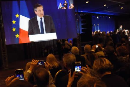 People film with mobile phones as Francois Fillon, member of Les Republicains political party and 2017 presidential candidate of the French centre-right, attends a political rally in Nice, France, January 11, 2017. REUTERS/Jean-Pierre Amet/Files