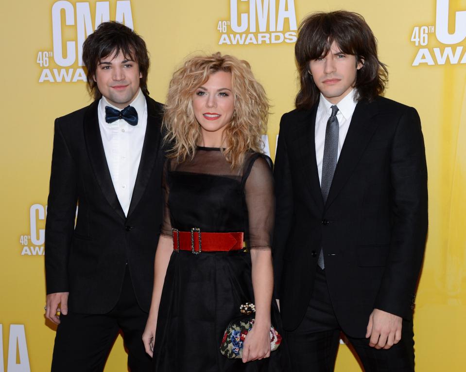 NASHVILLE, TN - NOVEMBER 01: (L-R) Neil Perry, Kimberly Perry, and Reid Perry of The Band Perry attend the 46th annual CMA Awards at the Bridgestone Arena on November 1, 2012 in Nashville, Tennessee. (Photo by Jason Kempin/Getty Images)