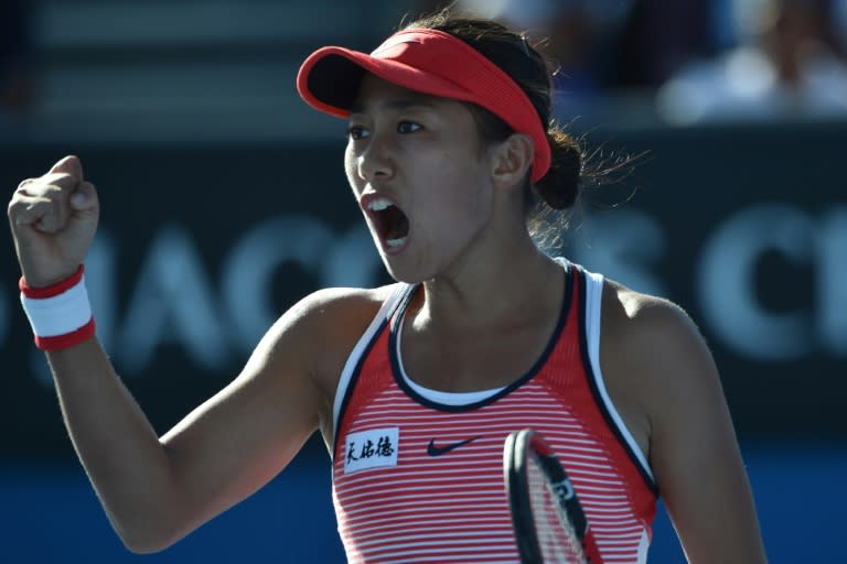 China's Zhang Shuai celebrates winning a point against France's Alize Cornet during their second round match at the Australian Open on January 21, 2016