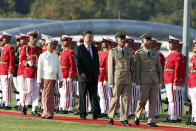 Myanmar's President Win Myint, left, and Chinese President Xi Jinping, center, inspect an honor guard during a welcome ceremony at the Presidential Palace in Naypyitaw, Myanmar, Friday, Jan. 17, 2020. (AP Photo/Aung Shine Oo)