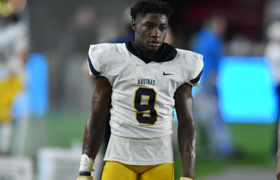 King Mack (9) of St. Thomas walks along the sideline during the during first half of the Class 7A state championship game against Tampa Bay Tech at DRV PNK Stadium, Fort Lauderdale, FL  Dec. 17, 2021. 