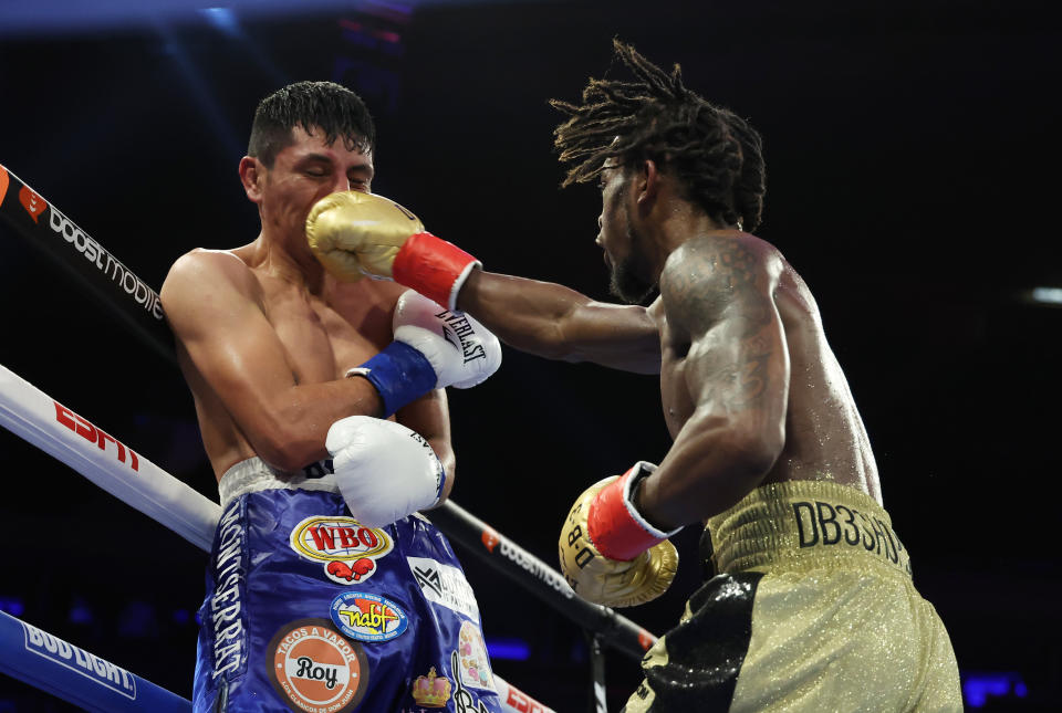 NEW YORK, NEW YORK - DECEMBER 10:  Keyshawn Davis punches Juan Carlos Burgos during their lightweight bout at Madison Square Garden on December 10, 2022 in New York City. (Photo by Al Bello/Getty Images)