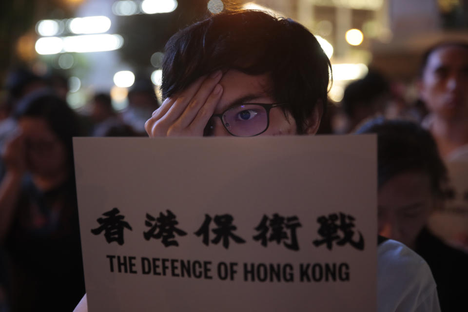 A pro-Hong Kong protester covers his right eye to honor a woman who suffered a serious eye injury in a recent protest, Friday, Aug. 30, 2019, in Hong Kong. Police have appealed to Hong Kong residents to stay from any non-authorized rallies on Saturday after authorities banned a major march, warning that those caught could face a five-year jail term. (AP Photo/Jae C. Hong)