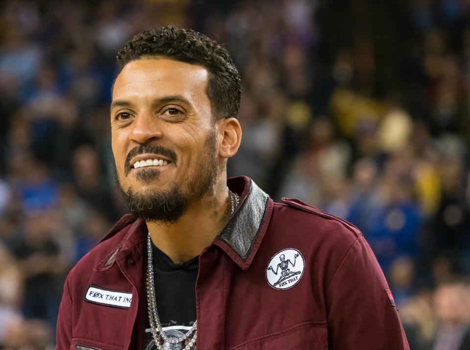 Former Golden State Warriors player Matt Barnes smiles before receiving his championship ring before a 2017 game against the Sacramento Kings.