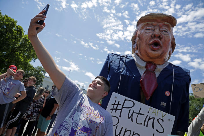 <p>A tourist takes a selfie with a large effigy of President Donald Trump during a protest rally against President Donald Trump’s firing of Federal Bureau of Investigation Director James Comey outside the White House May 10, 2017 in Washington, DC. Angry over the firing of Comey, about 300 demonstrators demanded that an independent special prosecutor investigate possible ties between the Trump campaign and Russian officials. (Chip Somodevilla/Getty Images) </p>