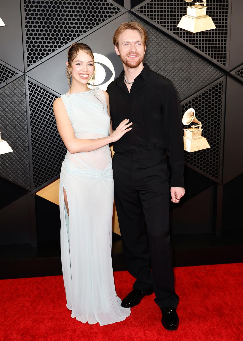 Claudia Sulewski and Finneas attend the 2024 Grammys.