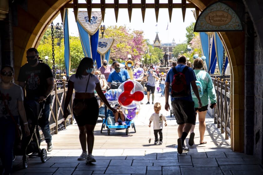 ANAHEIM, CA - May 03: Visitors pass through Sleepy Beauty Castle at Disneyland Resort in Anaheim, CA, as visitors return to the park with covid-safety restrictions in place, including the park only being at 25% capacity, Monday, May 3, 2021. (Jay L. Clendenin / Los Angeles Times)