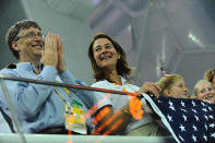 <p>Bill and Melinda cheered on the United States during a swimming competition at the 2008 Beijing Olympic games.</p>