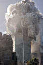 The north tower of New York's World Trade Center collapses after being struck by hijacked American Airlines Flt. 11, Tuesday, Sept. 11, 2001. <br><br>(AP Photo Richard Drew)<br><a href="http://www.life.com/gallery/59971/911-the-25-most-powerful-photos#index/0" rel="nofollow noopener" target="_blank" data-ylk="slk:;elm:context_link;itc:0;sec:content-canvas" class="link "><br></a>
