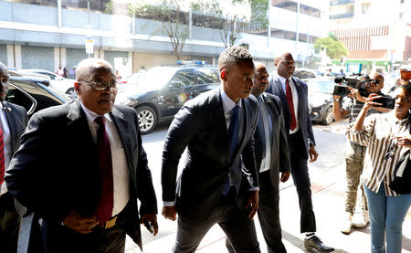FILE PHOTO: Duduzane Zuma arrives with his father, former South African president Jacob Zuma, ahead of Duduzane's appearance at the Specialised Commercial Crimes Court in Johannesburg, South Africa, January 24, 2019. REUTERS/Siphiwe Sibeko/File Photo
